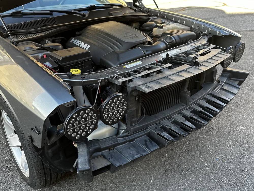 Jeep headlight units mounted on the first iteration of the custom brackets, front end open