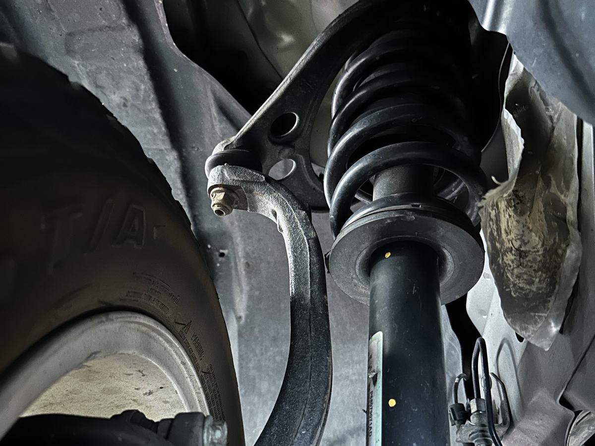 Front suspension with the lift spacer installed on top of the coilover