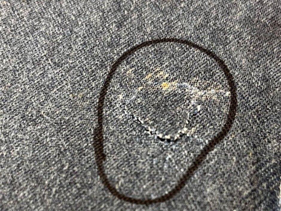 Close view of the denim panel fractured through after the tenth strike