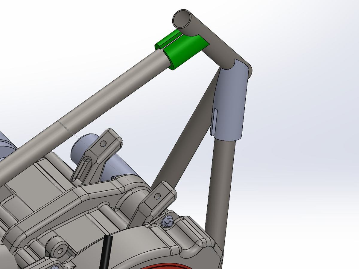 CAD view of the frame front with a green 3D-printed notch sleeve located on a tube at a joint