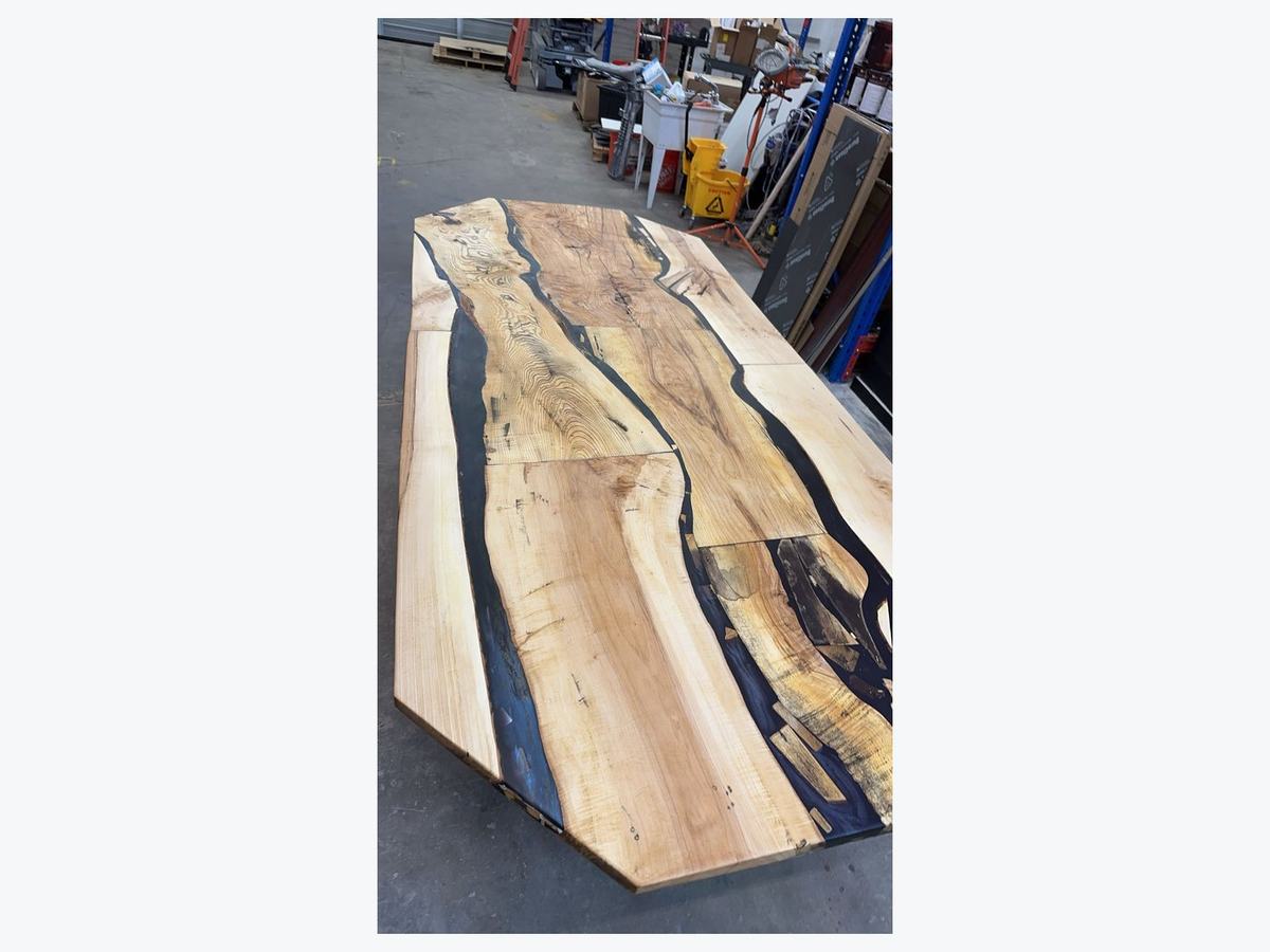 Live-edge river table with blue epoxy inlay
