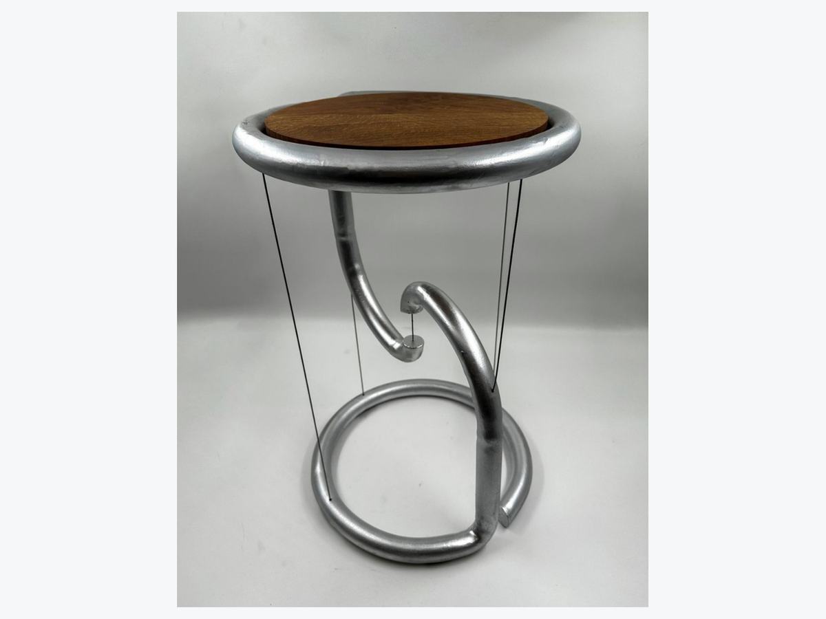 Tensegrity side table, oak top suspended on tension cables above a curved steel base